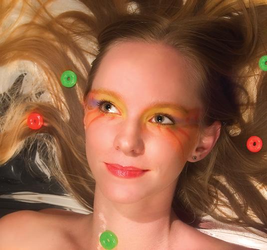 Female model photo shoot of ElectricSkittles Makeup in pop studios