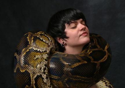Male model photo shoot of DHayes Photography in Studio.  Yes, that is a live, 17-foot long python.