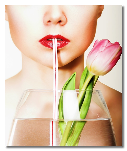Male model photo shoot of ukshots in Image is roughly as shot, the tulip is real and sitting the vase, no PS trickery