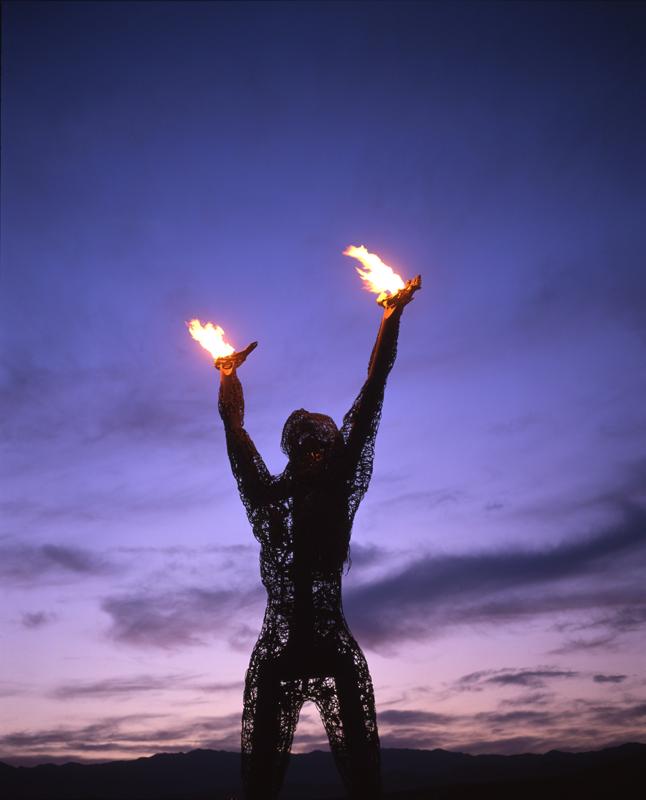 Male model photo shoot of D. M. Gremlin in Burning Man 2006 - Center Camp @ Sunset