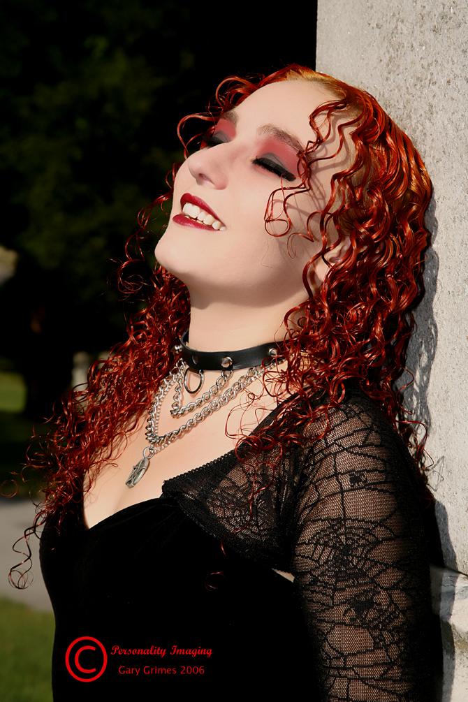 Female model photo shoot of RedHeather by Personality Imaging in Oak Hill cemetery Birmingham,AL