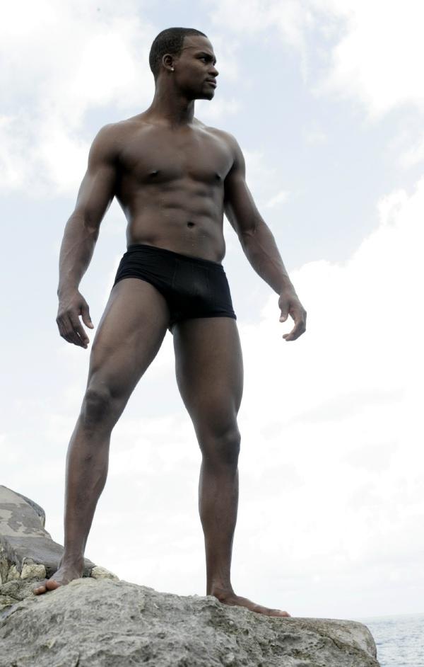 Male model photo shoot of musa cooper in on a rock