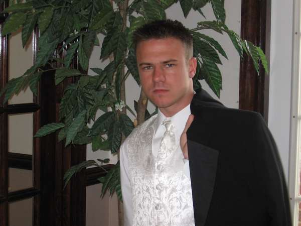 Male model photo shoot of Wayne Freeman in Black tie formals on Main Street