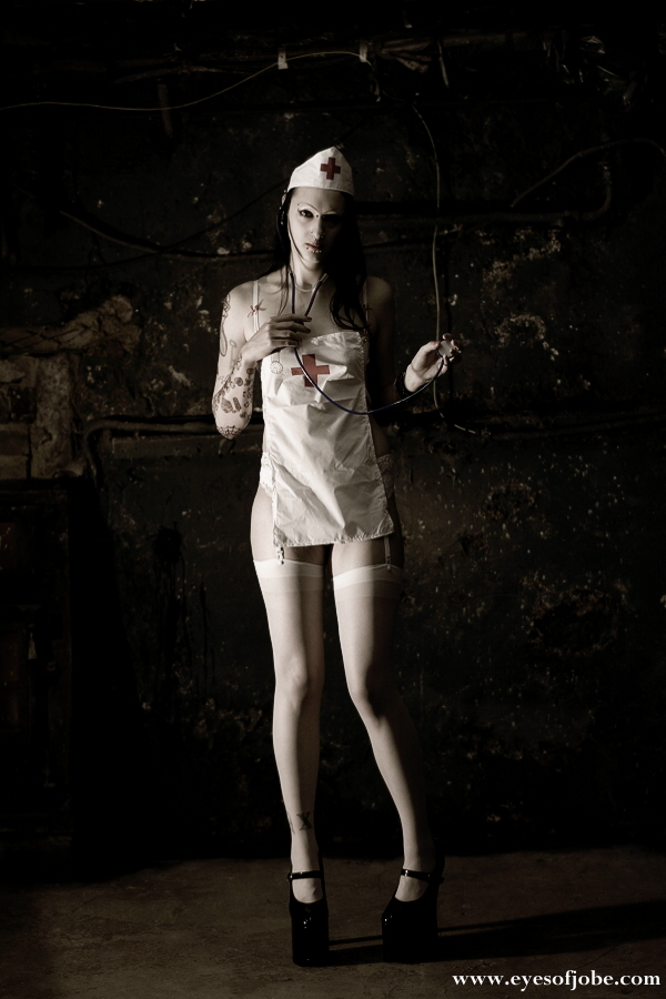 Male model photo shoot of Jobe in Steel Paintbrush Tattoo studio basement