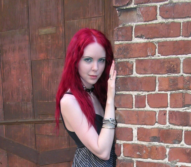 Female model photo shoot of androidkitty in random alleyway.
