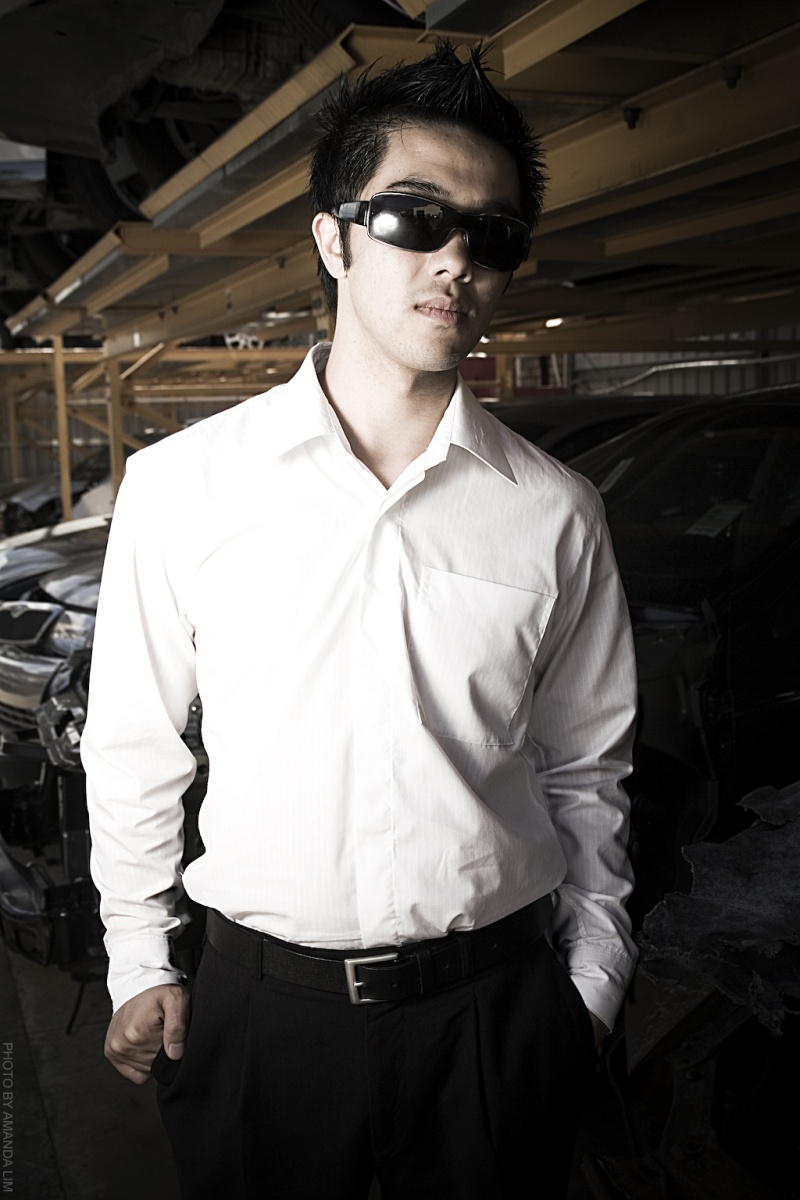 Male model photo shoot of Zac Kha in Car Salvage Yard