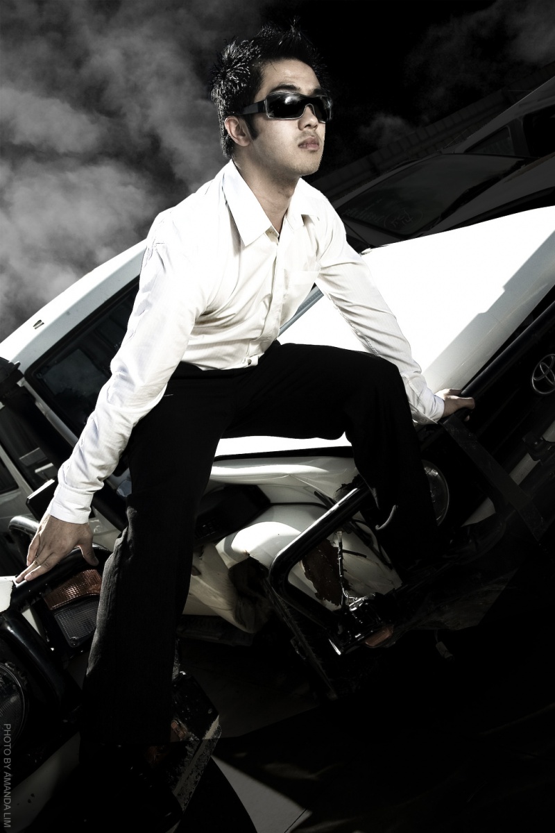 Male model photo shoot of Zac Kha in Car Salvage Yard