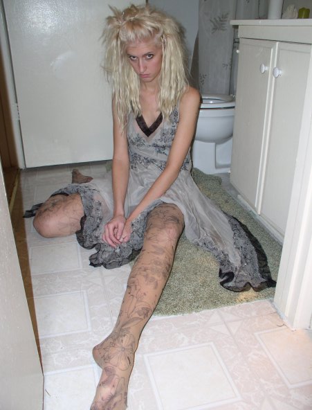 Female model photo shoot of Kali Love Heals in  Narrow doors. Bathroom floors.