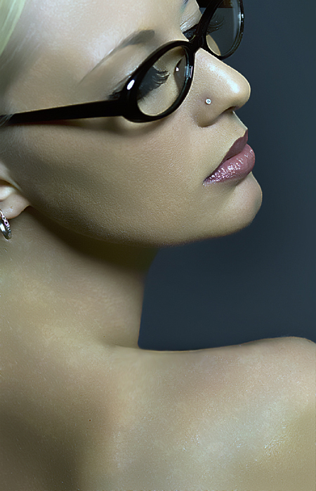 Female model photo shoot of Carma D by Steve Daubs Studios in My dorky glasses, retouched by DeeLicious Designs