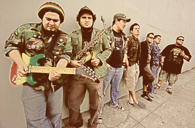 Male model photo shoot of Marco Escobar in Reggae band