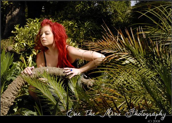 Female model photo shoot of waitaha makeup artistry in botanical gardens