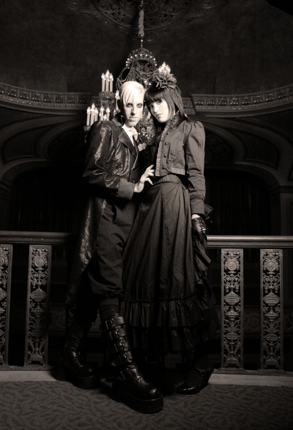Female and Male model photo shoot of shay colleen  and Ashlee Phoenix by Second Sight Photo in Seattle Historical Theatre , wardrobe styled by Dark Industry Clothing, makeup by SchockMakeup