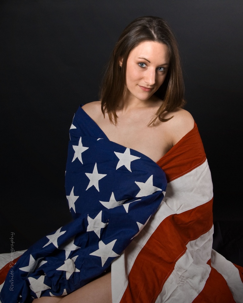 Female model photo shoot of Jennifer_Leigh by RWhite Photography in (taken on a table so the Flag would be respected and not touch the ground)