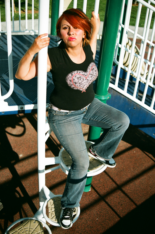 Female model photo shoot of Cnonymous in playground, silly!