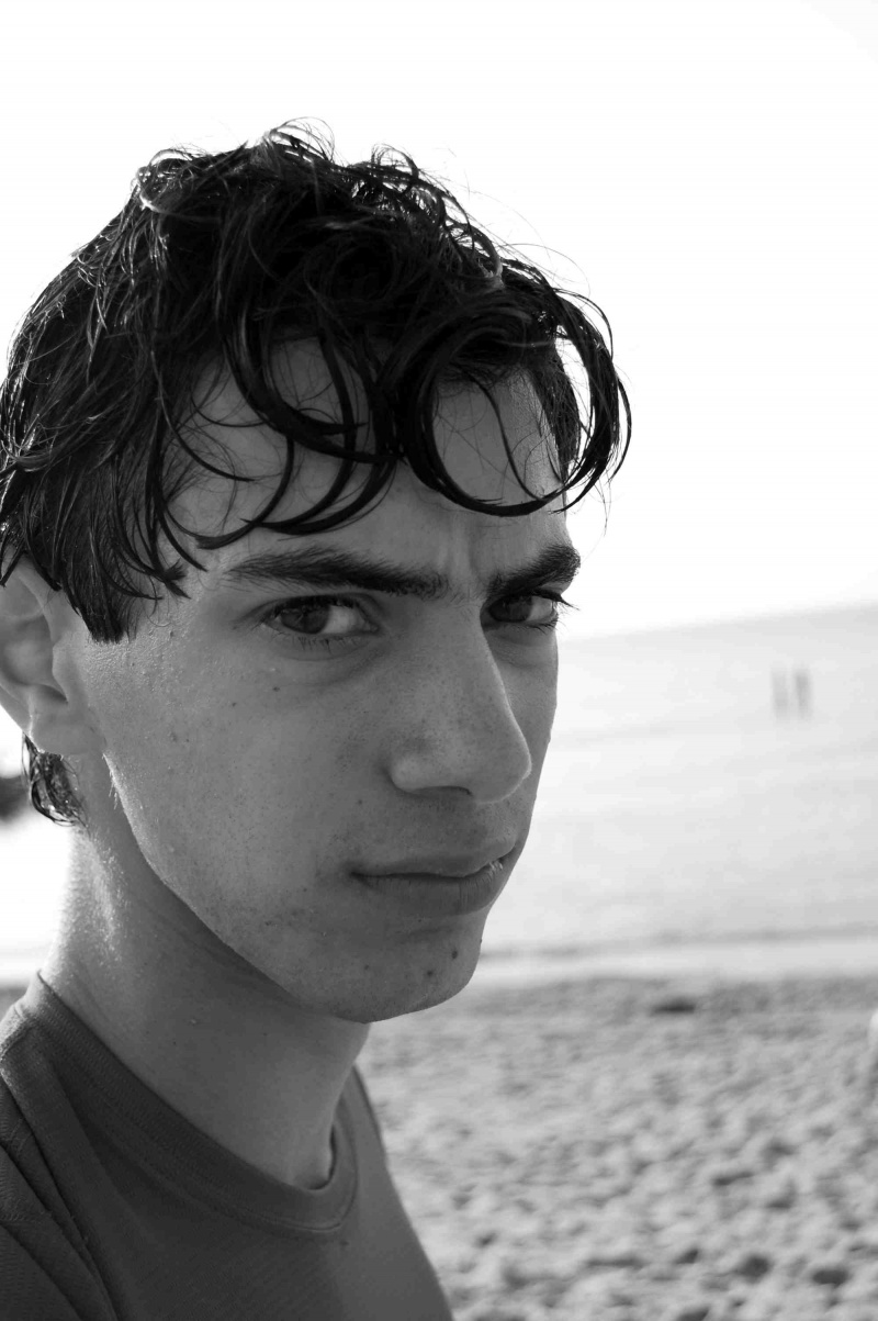 Male model photo shoot of samuel photographer in the beach near our house in Falmouth, MA