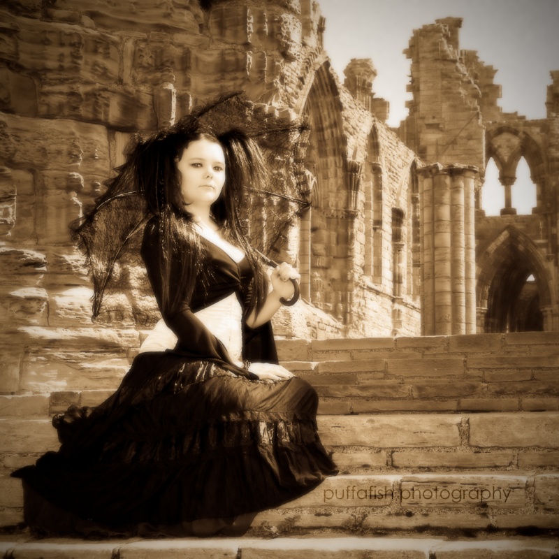 Female model photo shoot of Stacey Andrews by puffafish photography in Whitby Abbey