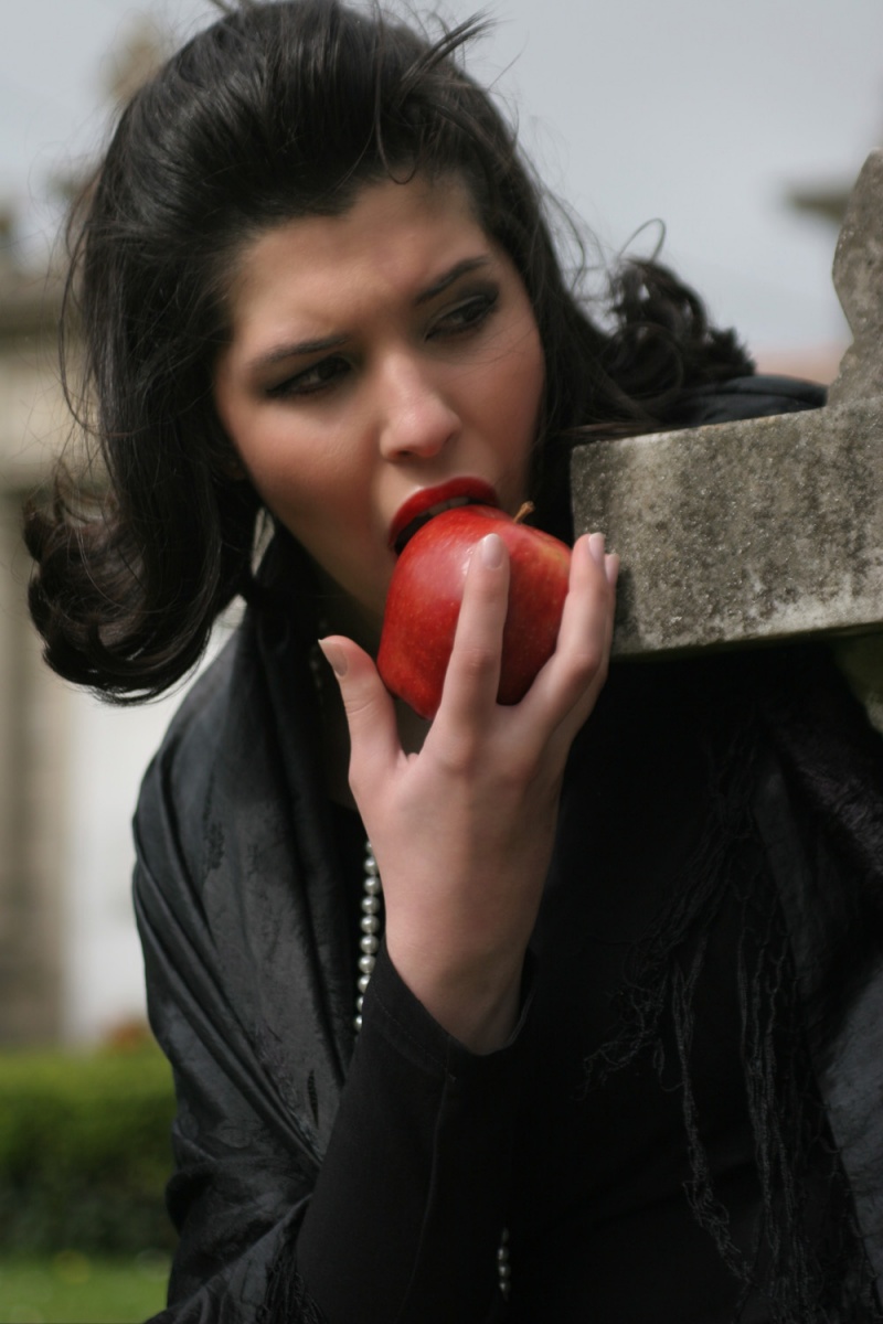 Female model photo shoot of Lucia M Goday in graveyard at Cesures (Spain)