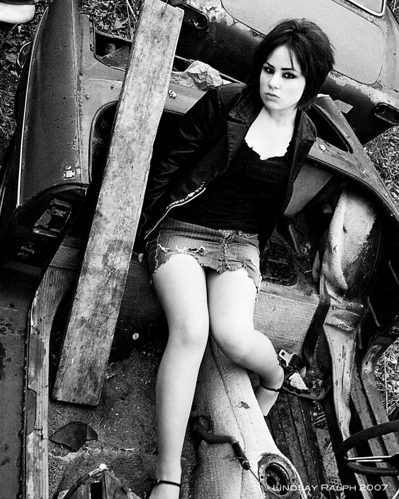 Female model photo shoot of LindsayRalph in Car junk yard
