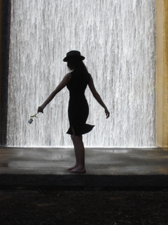 Female model photo shoot of Athena Adair by Maricelli Photography in Transco Towers Water Wall Houston, TX