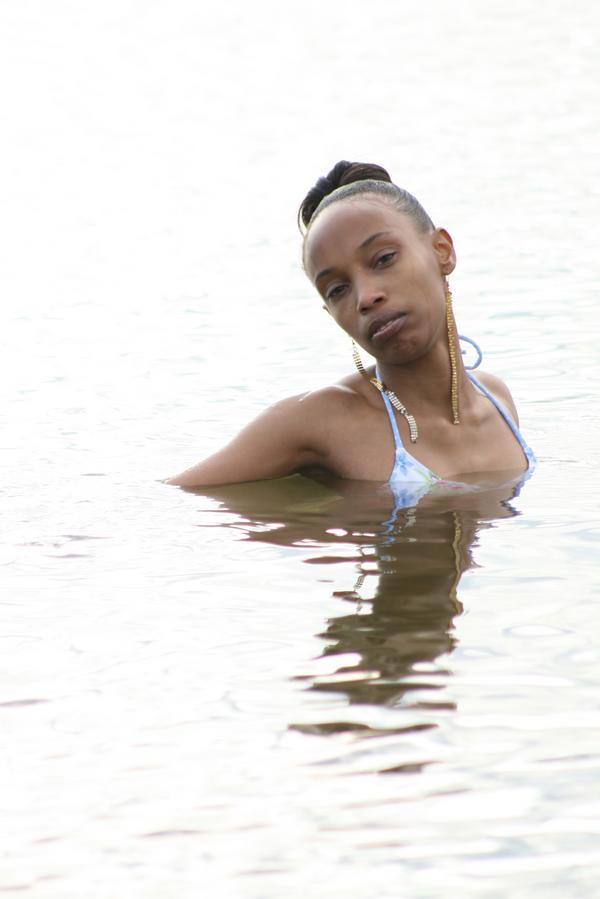 Female model photo shoot of The Caramel Bombshell in Yorktown Beach, Va