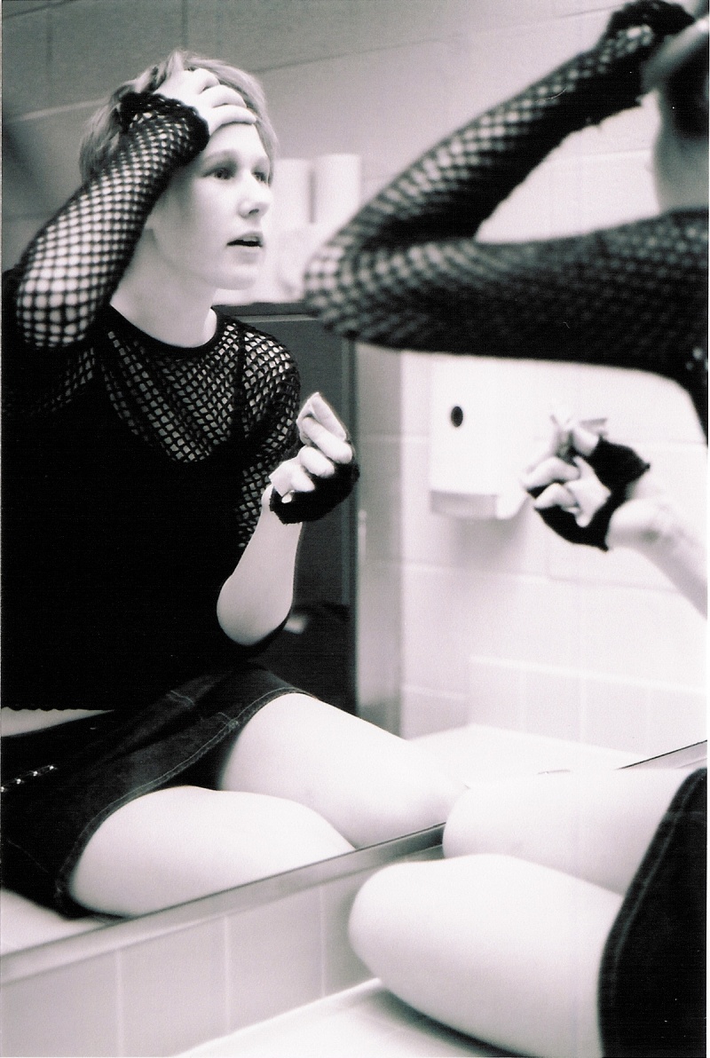 Female model photo shoot of Willow Jack in men's restroom