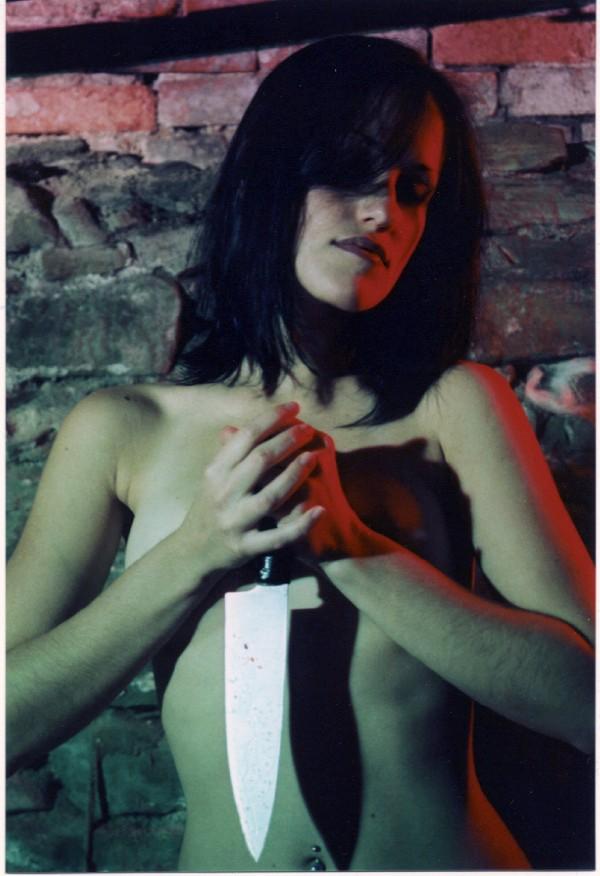 Female model photo shoot of Cate Boleyn in Tamara's basement