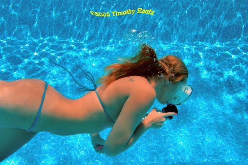 Male and Female model photo shoot of Timothy Nantz and kelso in secret underwater training facility