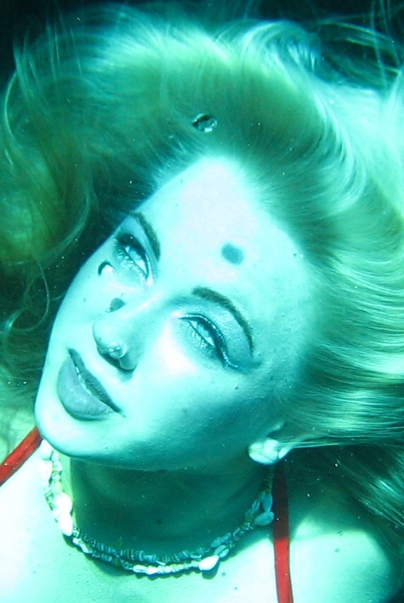 Female model photo shoot of underwater model in 85 ' in natural fresh water spring.