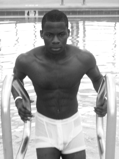 Male model photo shoot of rotimi in the pool