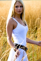 Female model photo shoot of Rosie Torres in A field next to the airport