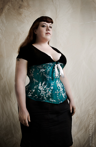 Female model photo shoot of 160 Proof Corsetry by Luke Copping, makeup by Rachel Mazzie