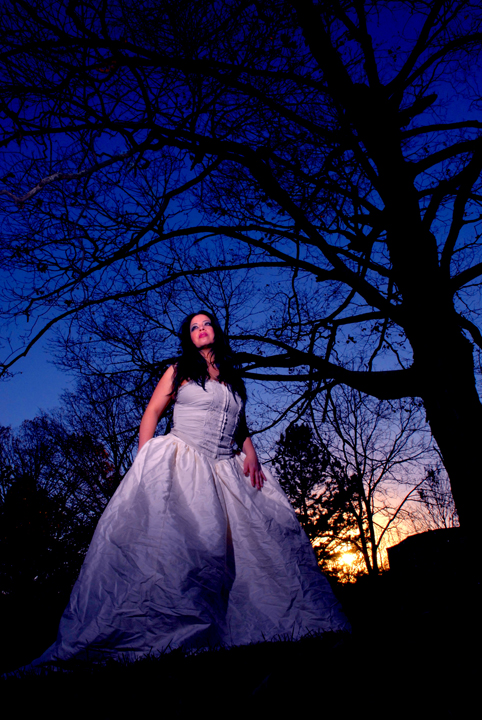 Female model photo shoot of Glam Girl Photography in Cemetery in Fayetteville