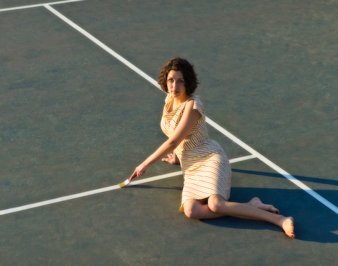Female model photo shoot of Kaya Knight by Maggie Yurachek in tennis court 