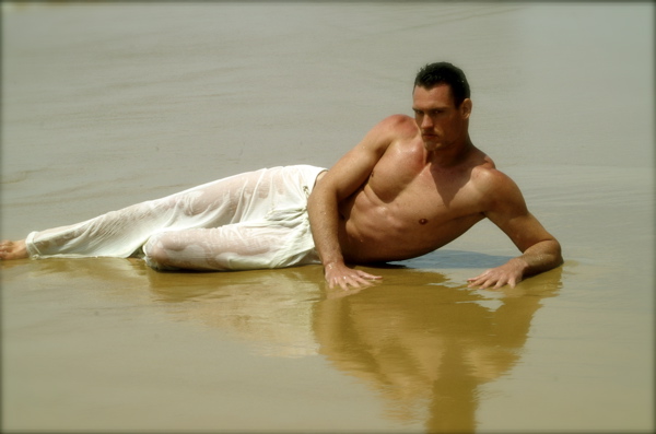 Male model photo shoot of BODYTORQUE in portugal beach