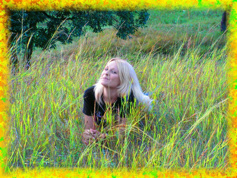Female model photo shoot of KarenS in hay field