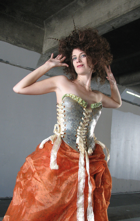 Female model photo shoot of Ceramic Corset Designs in California