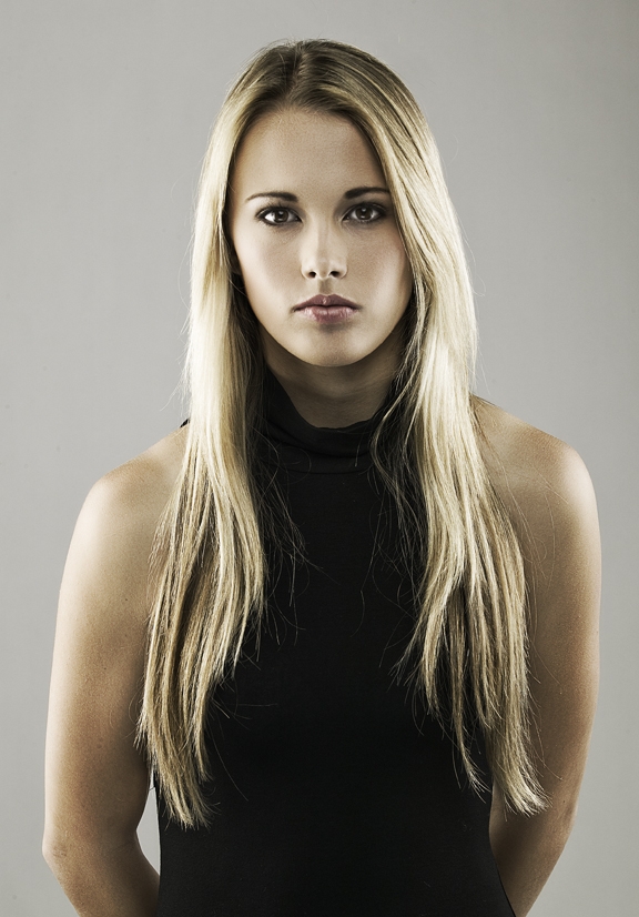Female model photo shoot of Britte by Joel Grimes, makeup by War Paint