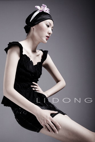 Male model photo shoot of Li Dong in studio