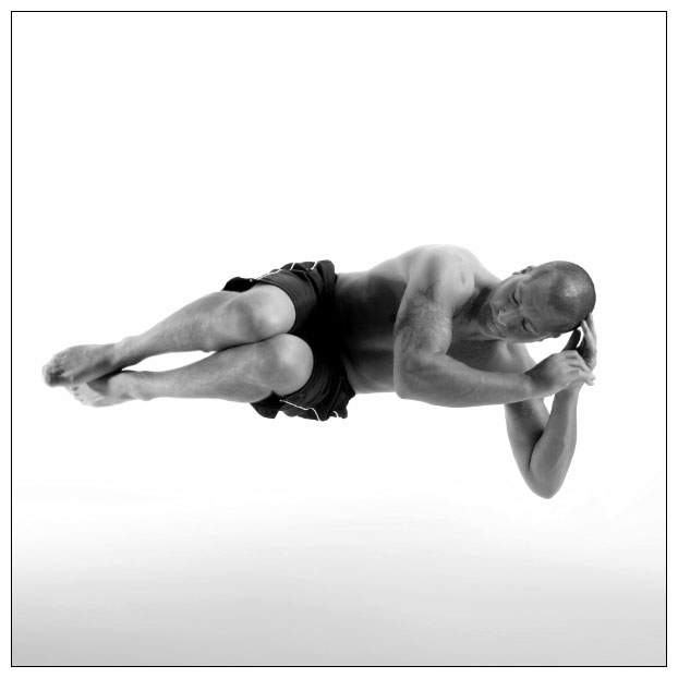 Male model photo shoot of VLS Photography in I asked the model to jump in the air sideways to create the illusion of sleeping in the air.  I like the juxtaposition of a dynamic movement creating a peaceful, calm pose.  No supports were used to hold the model up.