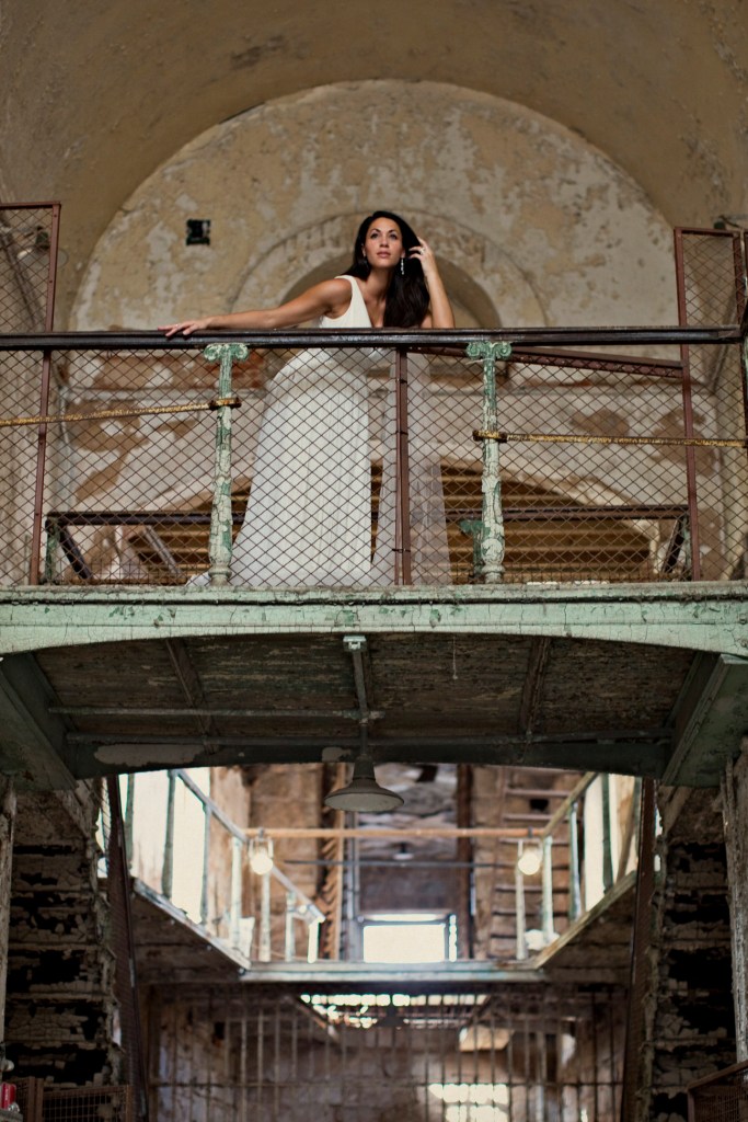 Female model photo shoot of Margo Samara in Eastern State Penitentiary