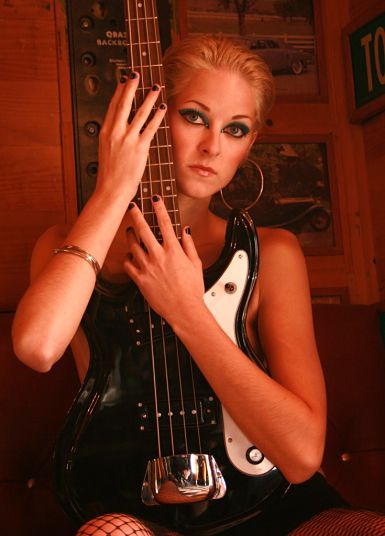 Female model photo shoot of Lindsy Del by EBrisson Photography in Guitar Shop