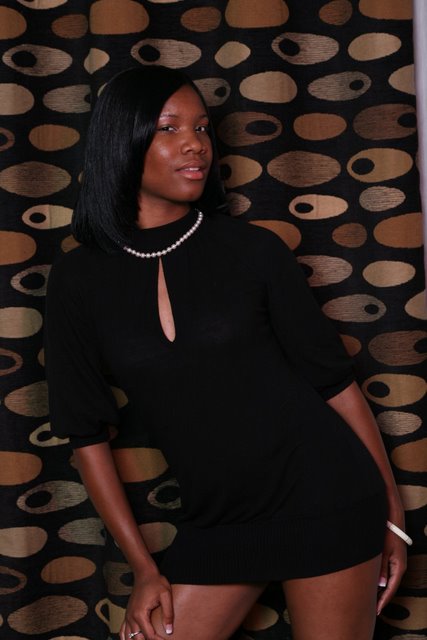 Female model photo shoot of Tisha Tee in Skyscape highrise (Downtown Minneapolis)