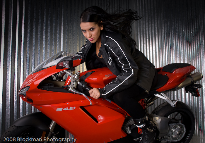 Male and Female model photo shoot of Alan Brockman and Silviana in Indy Ducati, Indianapolis, IN, hair styled by Hair by Ryan, makeup by Misty Renee Al-Eryani