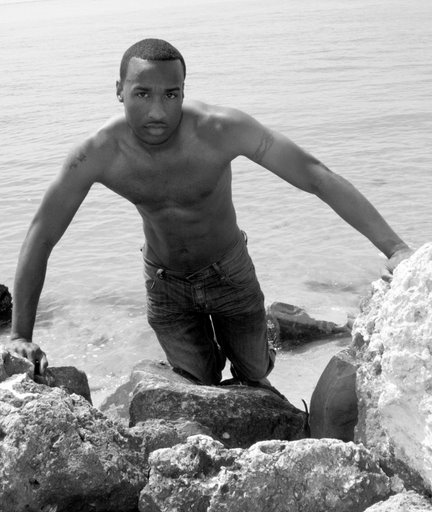 Male model photo shoot of Simuel by RiccRollinsPhotography in Rocks