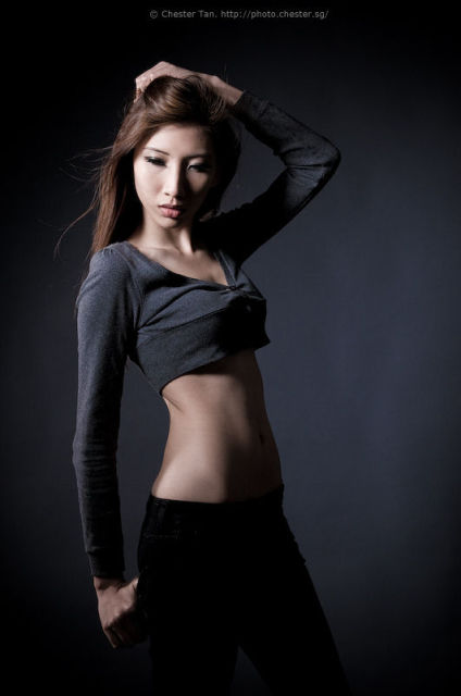 Female model photo shoot of S Emilia by Chester Tan in studio shoot