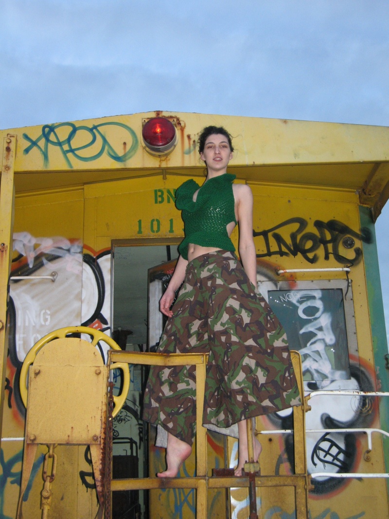 Female model photo shoot of NityaPrem in abandoned caboose, Portland, clothing designed by PebbleStarClothing