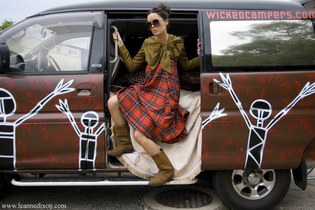 Female model photo shoot of Red Harriett by LeanneDixon Photography in Wicked Campers