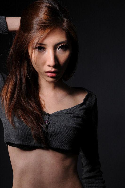 Female model photo shoot of S Emilia by Chester Tan in studio