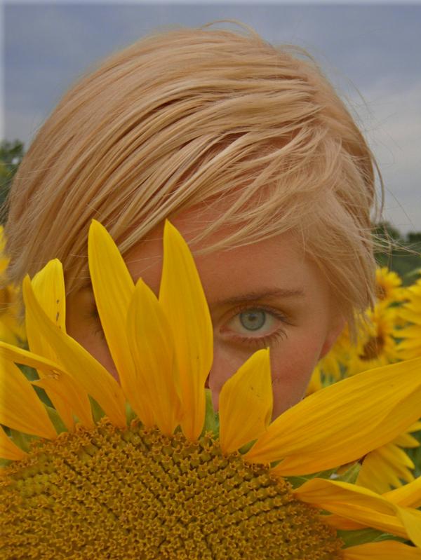 Female model photo shoot of Weslie in Sunflower Field, Dayton