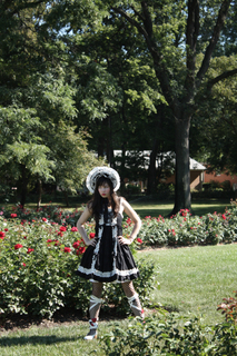 Female model photo shoot of Faune Hill in Park of Roses